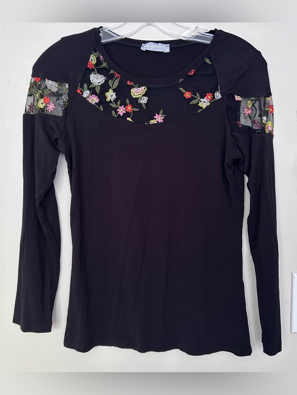 Milan Kiss black top  floral embroidery sheer mesh panels neckline shoulders.